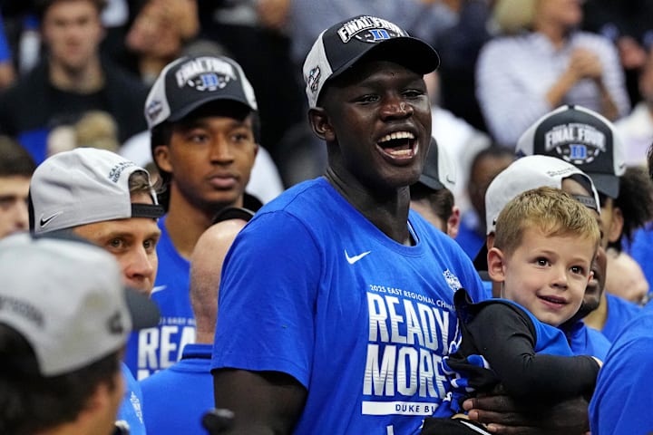 Duke center Khaman Maluach cheers as the Blue Devils cut down the nets after beating the Alabama in March Madness