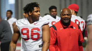 Mar 7, 2024; Columbus, OH, USA; Ohio State Buckeyes defensive end Eddrick Houston (96) works with defensive line coach Larry Johnson during spring football practice at the Woody Hayes Athletic Center.