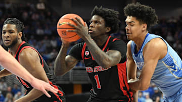 Dec 31, 2024; Omaha, Nebraska, USA;  St. John's basketball guard Kadary Richmond (1) drives against Creighton Bluejays forward Jasen Green (0) during the first half at CHI Health Center Omaha.