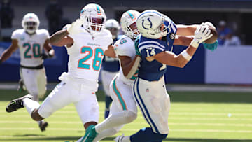 Sep 7, 2025; Indianapolis, Indiana, USA; Indianapolis Colts wide receiver Alec Pierce (14) makes a catch against Miami Dolphins cornerback Rasul Douglas (26) and safety Minkah Fitzpatrick (29) during the second half at Lucas Oil Stadium. Mandatory Credit: Trevor Ruszkowski-Imagn Images