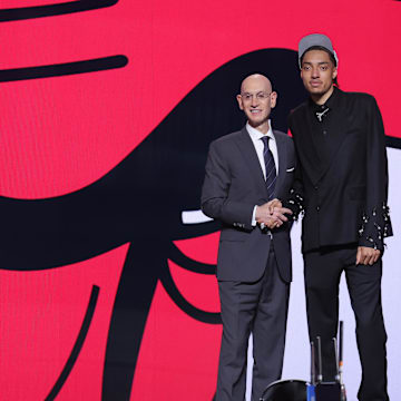 Jun 25, 2025; Brooklyn, NY, USA;  Noa Essengue stands with NBA commissioner Adam Silver after being selected as the 12th pick by the Chicago Bulls in the first round of the 2025 NBA Draft at Barclays Center. Mandatory Credit: Brad Penner-Imagn Images