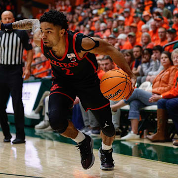 Feb 8, 2025; Fort Collins, Colorado, USA; San Diego State Aztecs guard Nick Boyd (2) controls the ball as Colorado State Rams guard Ethan Morton (25) guards in the first half at Moby Arena. Mandatory Credit: Isaiah J. Downing-Imagn Images