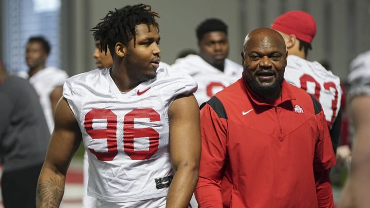 Mar 7, 2024; Columbus, OH, USA; Ohio State Buckeyes defensive end Eddrick Houston (96) works with defensive line coach Larry Johnson during spring football practice at the Woody Hayes Athletic Center.