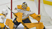 Jan 25, 2025; Anaheim, California, USA; Nashville Predators goaltender Juuse Saros (74) makes a save in the first period against the Anaheim Ducks at Honda Center. Mandatory Credit: Jayne Kamin-Oncea-Imagn Images