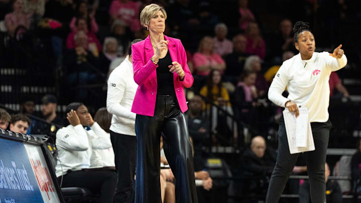 Iowa head coach Jan Jensen calls a play for her team during a game against the Washington Huskies Feb. 11, 2026 at Carver-Hawkeye Arena in Iowa City, Iowa.