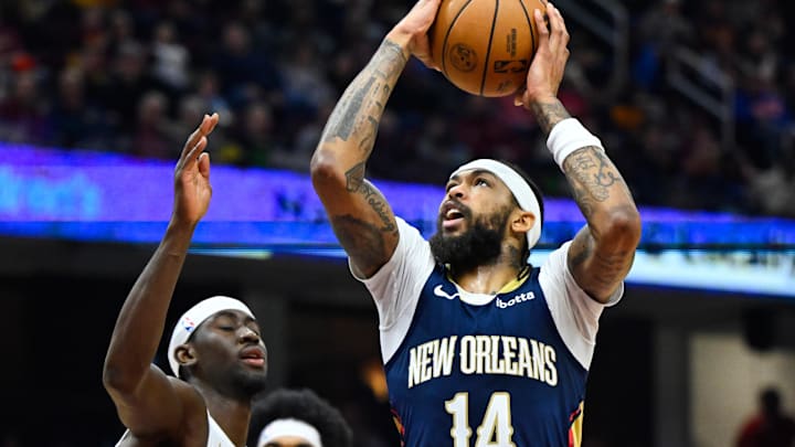 Dec 21, 2023; Cleveland, Ohio, USA; New Orleans Pelicans forward Brandon Ingram (14) drives against Cleveland Cavaliers guard Caris LeVert (3) in the second quarter at Rocket Mortgage FieldHouse. Mandatory Credit: David Richard-Imagn Images