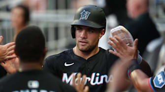 Aug 8, 2025; Cumberland, Georgia, USA; Miami Marlins center fielder Jakob Marsee (87) scores a run against the Atlanta Braves during the fourth inning at Truist Park. Mandatory Credit: Mady Mertens-Imagn Images