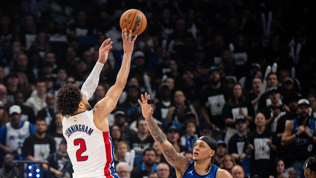 May 1, 2026; Orlando, Florida, USA; Detroit Pistons guard Cade Cunningham (2) shoots the ball over Orlando Magic forward Paolo Banchero (5) in the third quarter during game six of the first round of the 2026 NBA Playoffs at Kia Center. Mandatory Credit: Jeremy Reper-Imagn Images