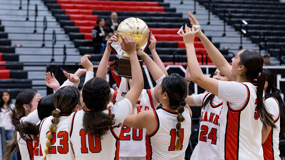 Hanks girls lift their trophy in celebration of a 39-23 win over Andress during a Class 5A, Division 2 bidistrict girls basketball playoff game on Tuesday, Feb. 17, 2026, at Hanks High School in El Paso, Texas. Hanks girls lift their trophy in celebration of a 39-23 win over Andress during a Class 5A, Division 2 bidistrict girls basketball playoff game on Tuesday, Feb. 17, 2026, at Hanks High School in El Paso, Texas.