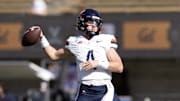 Nov 1, 2025; Berkeley, California, USA; Virginia Cavaliers quarterback Chandler Morris (4) warms up before the game against the California Golden Bears at California Memorial Stadium. Mandatory Credit: D. Ross Cameron-Imagn Images