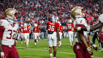 Nov 21, 2025; Raleigh, North Carolina, USA; NC State Wolfpack linebacker Kelvon McBride (36) smiles as he walks away from his fake out during the second half of the game against Florida State Seminoles at Carter-Finley Stadium. Mandatory Credit: Jaylynn Nash-Imagn Images