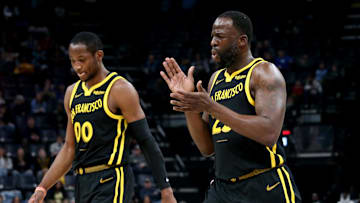 Jan 15, 2024; Memphis, Tennessee, USA; Golden State Warriors forward Jonathan Kuminga (00) and Golden State Warriors forward Draymond Green (23) walk to the bench at the end of the first quarter against the Memphis Grizzlies  at FedExForum. Mandatory Credit: Petre Thomas-Imagn Images