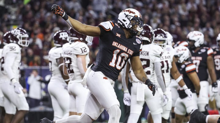 Dec 27, 2023; Houston, TX, USA; Oklahoma State Cowboys wide receiver Rashod Owens (10) celebrates after scoring a touchdowns against Texas A&M.