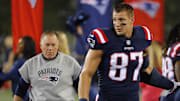 New England Patriots tight end Rob Gronkowski and Patriots head coach Bill Belichick walk along the sidelines before their game against the Houston Texans at Gillette Stadium. 