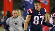 Sep 22, 2016; Foxborough, MA, USA;  New England Patriots tight end Rob Gronkowski (87) and  Patriots head coach Bill Belichick walk along the sidelines before their game against the Houston Texans at Gillette Stadium. Mandatory Credit: Winslow Townson-Imagn Images