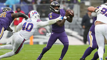 Oct 2, 2022; Baltimore, Maryland, USA; Baltimore Ravens quarterback Lamar Jackson (8) pressured by Buffalo Bills linebacker Von Miller (40) in the second quarter at M&T Bank Stadium. Mandatory Credit: Mitch Stringer-Imagn Images