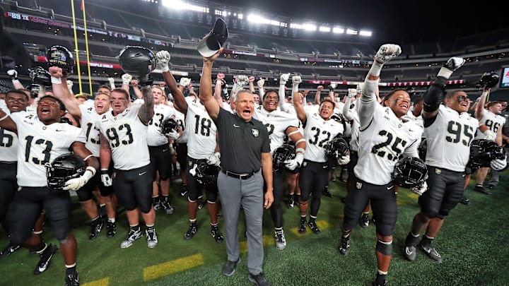 Army Black Knights head coach Jeff Monken celebrates with his team after beating the Temple Owls. Army Black Knights head coach Jeff Monken celebrates with his team after beating the Temple Owls.