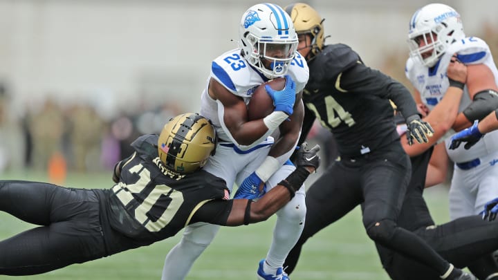 Oct 1, 2022; West Point, New York, USA; Georgia State Panthers running back Marcus Carroll (23) is dragged down by Army Black Knights defensive back Marquel Broughton (20) during the first half at Michie Stadium. Mandatory Credit: Danny Wild-USA TODAY Sports