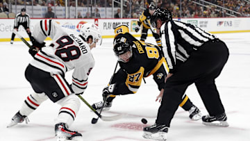 Oct 10, 2023; Pittsburgh, Pennsylvania, USA; Chicago Blackhawks center Connor Bedard (98) and Pittsburgh Penguins center Sidney Crosby (87) take a face-off during the third period at the PPG Paints Arena. Chicago won 4-2.  Mandatory Credit: Charles LeClaire-Imagn Images