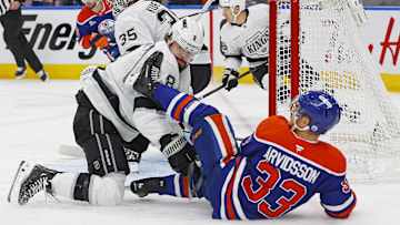 Apr 25, 2025; Edmonton, Alberta, CAN; Los Angeles Kings defensemen Drew Doughty (8) and Edmonton Oilers forward Victor Arvidsson (33) battle for position during the first period in game three of the first round of the 2025 Stanley Cup Playoffs at Rogers Place. Mandatory Credit: Perry Nelson-Imagn Images