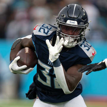 Tennessee Titans running back Tyjae Spears (32) runs for a touchdown after breaking several Jacksonville Jaguars tackles in the first quarter of their game at Nissan Stadium in Nashville, Tenn., Sunday, Jan. 7, 2024.