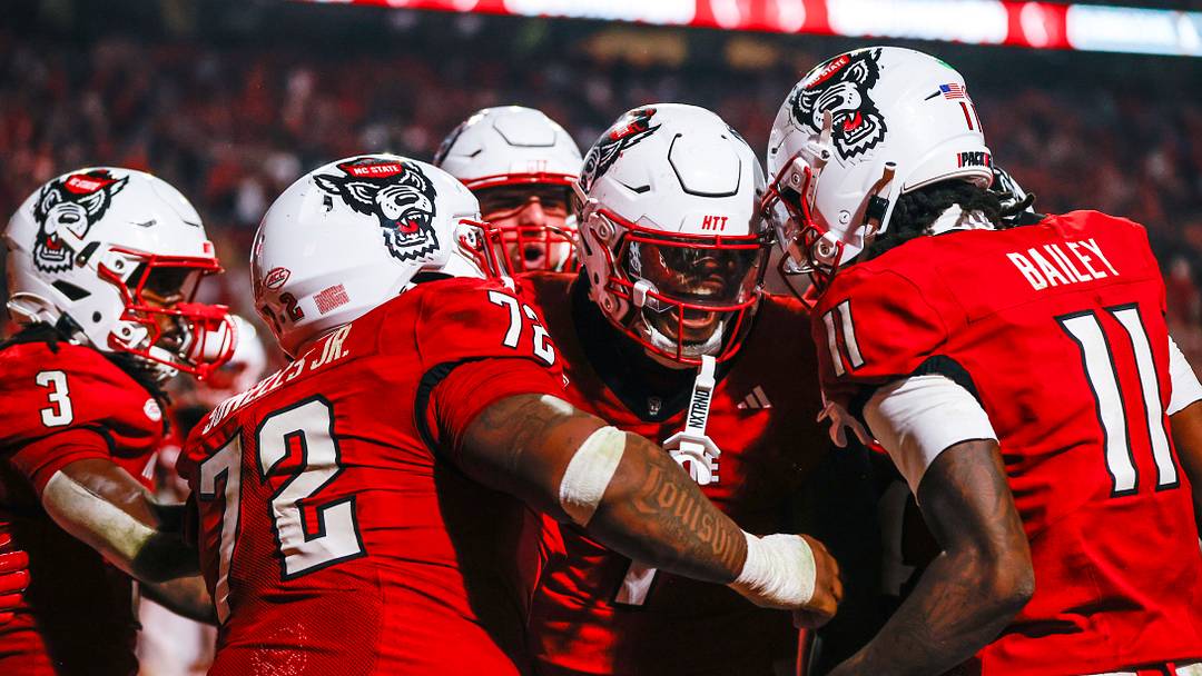 Nov 21, 2025; Raleigh, North Carolina, USA;  NC State Wolfpack tight end Justin Joly (7) celebrates his touchdown to win the game during the second half of the game against Florida State Seminoles at Carter-Finley Stadium. Mandatory Credit: Jaylynn Nash-Imagn Images