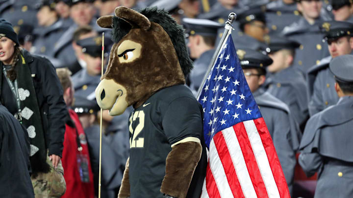 Dec 14, 2024; Landover, Maryland, USA; The Army Black Knights mascot stands with cadets and a flag during the second half of the the 125th Army-Navy game at Northwest Stadium. Dec 14, 2024; Landover, Maryland, USA; The Army Black Knights mascot stands with cadets and a flag during the second half of the the 125th Army-Navy game at Northwest Stadium.