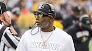 Nov 8, 2025; Morgantown, West Virginia, USA; Colorado Buffaloes head coach Deion Sanders walks along the sidelines late in the fourth quarter against the West Virginia Mountaineers at Milan Puskar Stadium. Mandatory Credit: Ben Queen-Imagn Images
