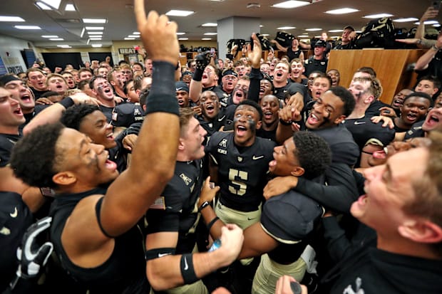Army football players celebrate after moving to 6–0 this season.