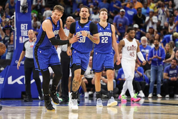 Orlando Magic guard Cole Anthony celebrates with teammates during an NBA playoff game versus the Cleveland Cavaliers