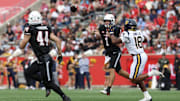 Nov 1, 2025; Houston, Texas, USA; Houston Cougars quarterback Conner Weigman (1) completes a pass to running back Dean Connors (44) as West Virginia Mountaineers linebacker Curtis Jones Jr. (18) rushes the quarterback  in the first half at TDECU Stadium. Mandatory Credit: Thomas Shea-Imagn Images