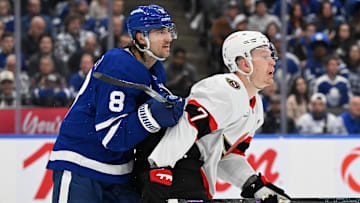 Apr 22, 2025; Toronto, Ontario, CAN;  Toronto Maple Leafs defenseman Chris Tanev (8) pushes Ottawa Senators forward Brady Tkachuk (7) away from his goal area in the second period in game two of the first round of the 2025 Stanley Cup Playoffs at Scotiabank Arena. Mandatory Credit: Dan Hamilton-Imagn Images