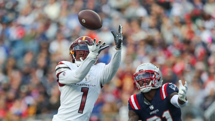 Nov 5, 2023; Foxborough, Massachusetts, USA; Washington Commanders receiver Jahan Dotson (1) catches a pass for a touchdown during the second half against the New England Patriots at Gillette Stadium. Paul Rutherford-USA TODAY Sports