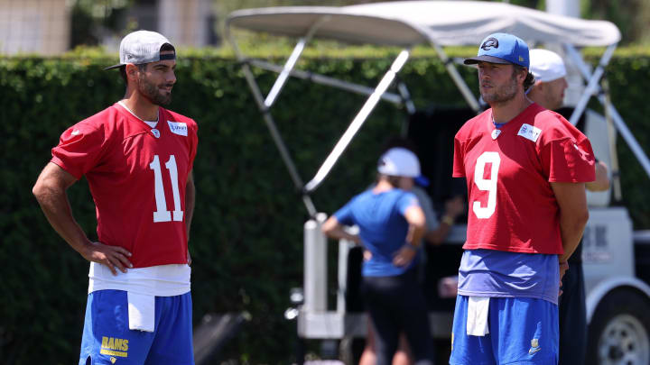 Jul 31, 2024; Los Angeles, CA, USA;  Los Angeles Rams quarterback Jimmy Garoppolo (11) and quarterback Matthew Stafford (9) talk during training camp at Loyola Marymount University. Mandatory Credit: Kiyoshi Mio-USA TODAY Sports