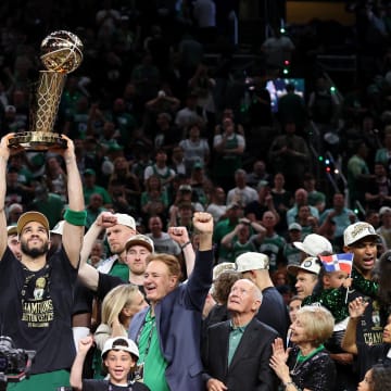 Jun 17, 2024; Boston, Massachusetts, USA; Boston Celtics forward Jayson Tatum (0) lifts the trophy after winning the 2024 NBA Finals against the Dallas Mavericks at TD Garden. Mandatory Credit: Peter Casey-USA TODAY Sports