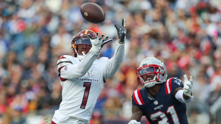 Nov 5, 2023; Foxborough, Massachusetts, USA; Washington Commanders receiver Jahan Dotson (1) catches a pass for a touchdown during the second half against the New England Patriots at Gillette Stadium. Mandatory Credit: Paul Rutherford-USA TODAY Sports