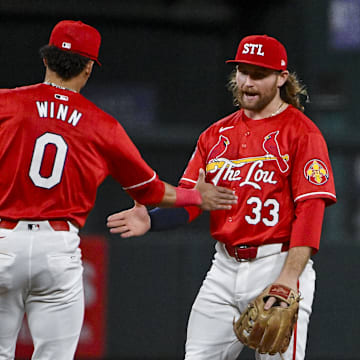 Jun 7, 2024; St. Louis, Missouri, USA;  St. Louis Cardinals second baseman Brendan Donovan (33)celebrates with shortstop Masyn Winn (0) after the Cardinals defeated the Colorado Rockies at Busch Stadium. Mandatory Credit: Jeff Curry-Imagn Images