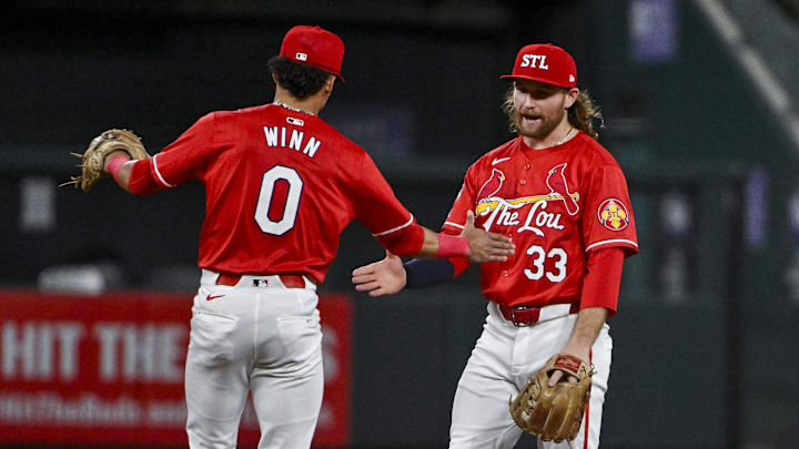 Jun 7, 2024; St. Louis, Missouri, USA;  St. Louis Cardinals second baseman Brendan Donovan (33)celebrates with shortstop Masyn Winn (0) after the Cardinals defeated the Colorado Rockies at Busch Stadium. Mandatory Credit: Jeff Curry-Imagn Images