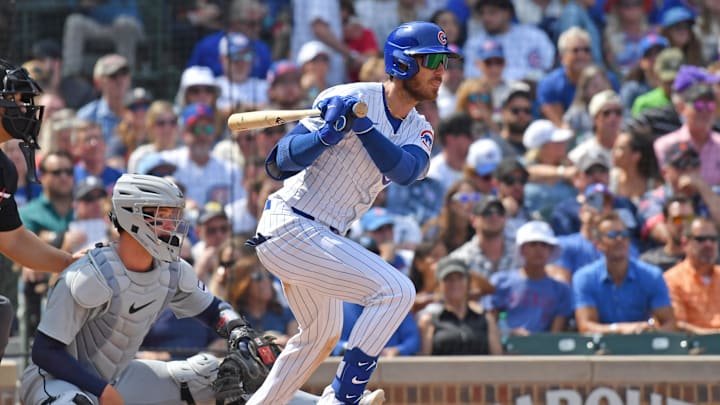 Aug 22, 2024; Chicago, Illinois, USA; Chicago Cubs right fielder Cody Bellinger (24) hits an RBI single during the fourth inning against the Detroit Tigers at Wrigley Field. Aug 22, 2024; Chicago, Illinois, USA; Chicago Cubs right fielder Cody Bellinger (24) hits an RBI single during the fourth inning against the Detroit Tigers at Wrigley Field.