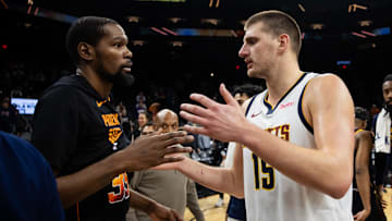 Dec 1, 2023; Phoenix, Arizona, USA; Denver Nuggets center Nikola Jokic (right) greets Phoenix Suns forward Kevin Durant following the game at Footprint Center. Mandatory Credit: Mark J. Rebilas-Imagn Images