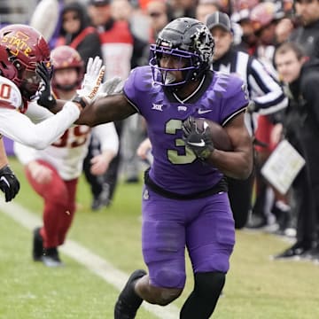 TCU Horned Frogs running back Emari Demercado is knocked out of bounds by Iowa State Cyclones defensive back Darien Porter