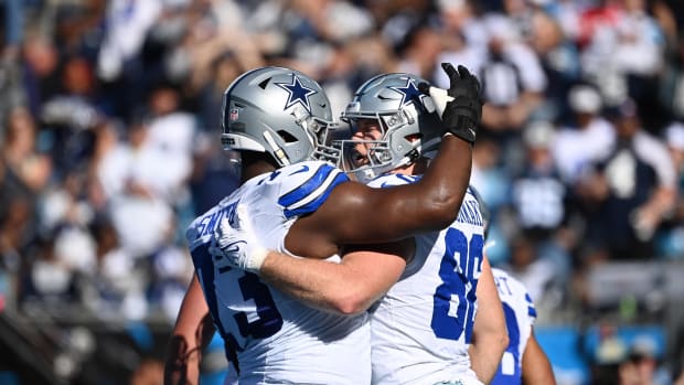 Dallas Cowboys tight end Luke Schoonmaker (86) celebrates with offensive tackle Tyler Smith (73) after scoring a touchdown in