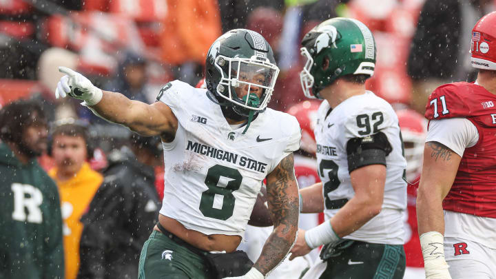 Oct 14, 2023; Piscataway, New Jersey, USA;  Michigan State Spartans running back Jalen Berger (8) celebrates after a first down run during the second half against the Rutgers Scarlet Knights at SHI Stadium. Mandatory Credit: Vincent Carchietta-USA TODAY Sports