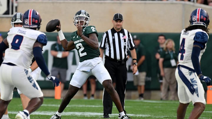 Aug 30, 2024; East Lansing, Michigan, USA;  Michigan State Spartans quarterback Aidan Chiles (2) throws a first down in the first quarter against the Florida Atlantic Owls at Spartan Stadium. Mandatory Credit: Dale Young-Imagn Images