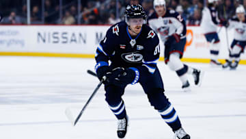 Nov 18, 2025; Winnipeg, Manitoba, CAN;  Winnipeg Jets forward Kyle Connor (81) skies after the puck in the Colorado Avalanche zone during the first period at Canada Life Centre. Mandatory Credit: Terrence Lee-Imagn Images