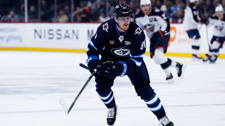 Nov 18, 2025; Winnipeg, Manitoba, CAN;  Winnipeg Jets forward Kyle Connor (81) skies after the puck in the Colorado Avalanche zone during the first period at Canada Life Centre. Mandatory Credit: Terrence Lee-Imagn Images