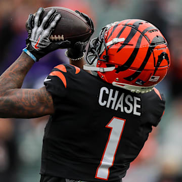 Dec 16, 2023; Cincinnati, Ohio, USA; Cincinnati Bengals wide receiver Ja'Marr Chase (1) catches a pass during warmups before the game against the Minnesota Vikings at Paycor Stadium. Mandatory Credit: Katie Stratman-USA TODAY Sports