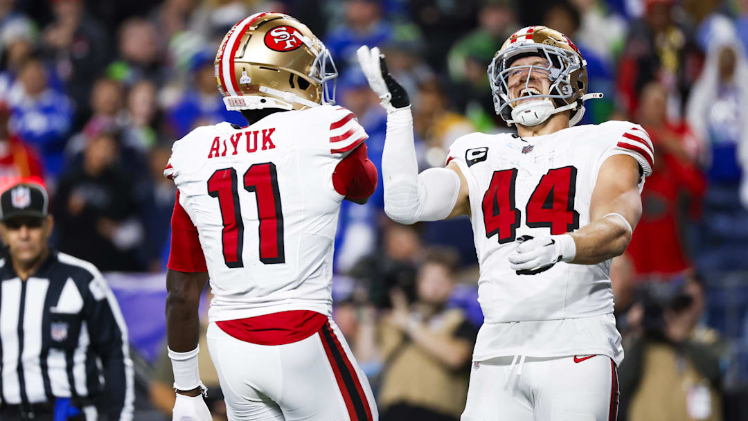 Oct 10, 2024; Seattle, Washington, USA; San Francisco 49ers fullback Kyle Juszczyk (44) celebrates with wide receiver Brandon Aiyuk (11) after rushing for a touchdown against the Seattle Seahawks at Lumen Field. Mandatory Credit: Joe Nicholson-Imagn Images