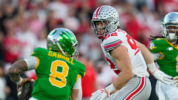Ohio State Buckeyes defensive end Caden Curry (92) pursues Oregon Ducks quarterback Dillon Gabriel (8) during the College Football Playoff quarterfinal at the Rose Bowl in Pasadena, Calif. on Jan. 1, 2025. Ohio State won 41-21.