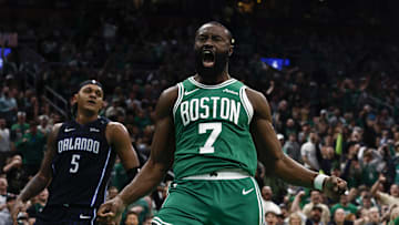 Apr 23, 2025; Boston, Massachusetts, USA; Boston Celtics guard Jaylen Brown (7) shouts out after dunking as Orlando Magic forward Paolo Banchero (5) turns away during the second half of game two of the first round of the 2024 NBA Playoffs at TD Garden. Mandatory Credit: Winslow Townson-Imagn Images